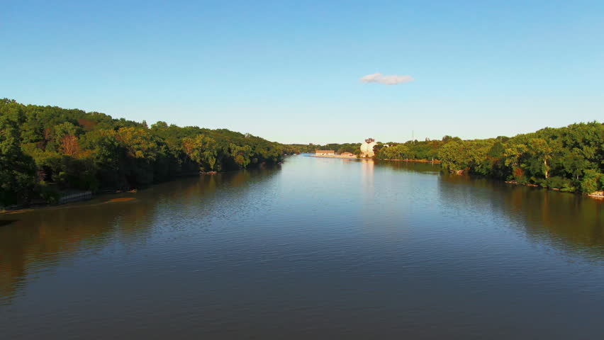 Aerial of Fox River with Wastewater Treatment Plant on Bank and a Small Kayak