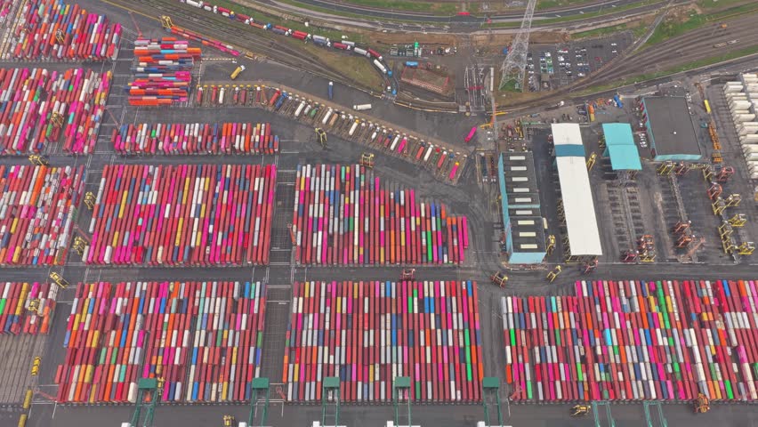 Antwerp port aerial view of containers, shipping cranes and vessels, Belgium