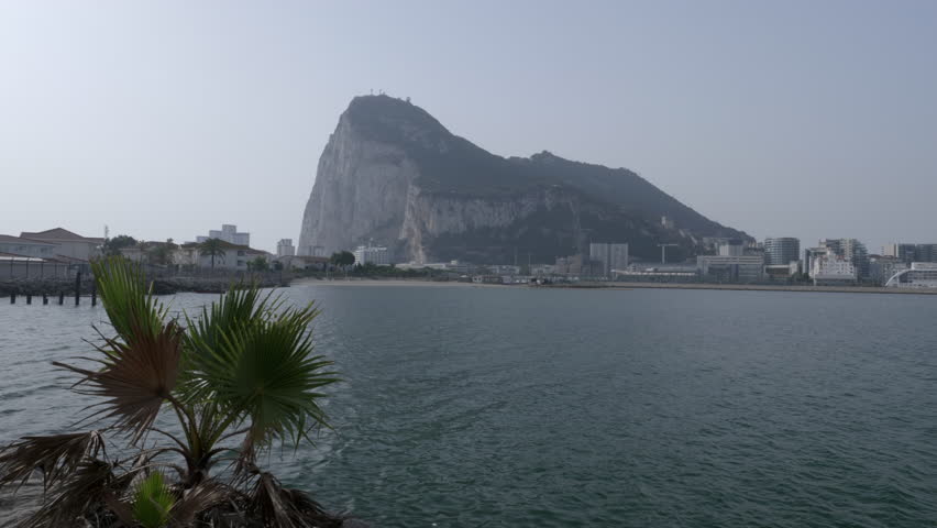 Gibraltar at sunset, with its airport and part of the skyline, as seen from La Linea de la Concepcion in Spain.