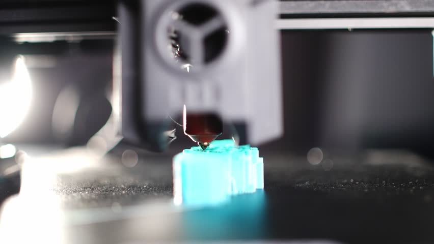 Close up of a 3D printer printing a plastic detail with high precision modern additive manufacturing process latest technologies for industrial production and prototyping. High quality 4k footage