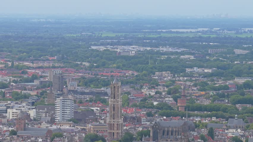 Aerial drone view of Dom Tower landmark rising above Utrecht city, Netherlands