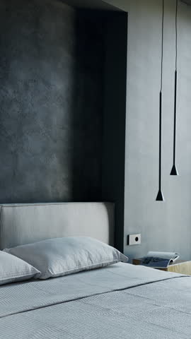 Modern bedroom interior design with gray walls and elegant furniture. Pillows rest on the made bed. Subtle lighting enhances the serene ambiance of the minimalist room. relaxation and comfort.