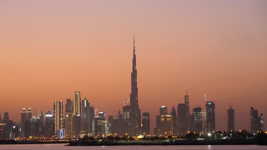 dubai city burj khalifa famous landmark skyline with orange sunset sky 4k video