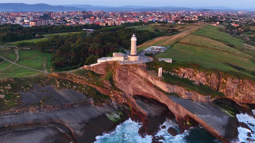 orbiting shot of Santander lighthouse in Cantabria, Santander is a city on the coast of Cantabria in northern Spain at sunrise, tourism in Spain, the bay of Biscay at sunrise. 