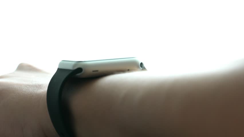 Explore the evolution of wearable technology with this captivating image, showcasing a hand interacting with a futuristic health monitoring device. Its holographic display symbolizes advancements in p