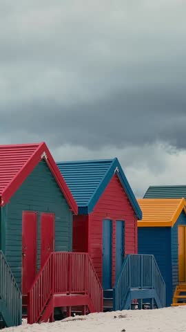 Colorful beach houses at Muizenberg beach Cape Town, Beach huts. Vertical video