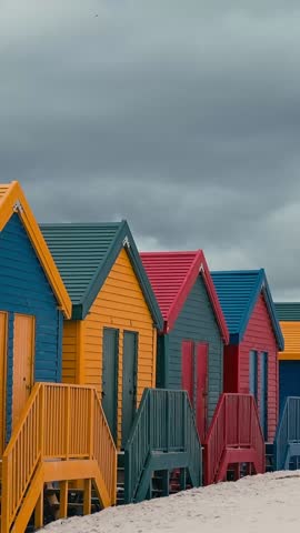 Colorful beach houses at Muizenberg beach Cape Town, Beach huts. Vertical video