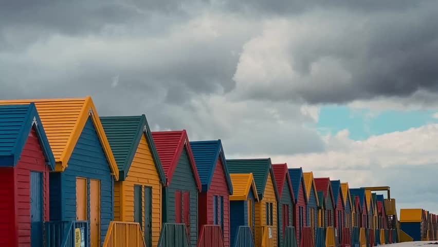 Video of iconic Muizenberg Beach huts at ocean coastline.Cape Town. South Africa.