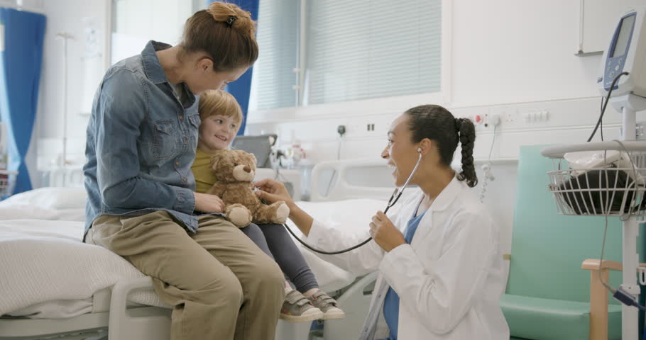 Child with Doctor and Mother, Medical Exam in Doctor's Office