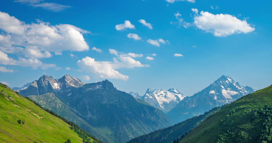 Timelapse of moving clouds over mountains. High quality 4k footage