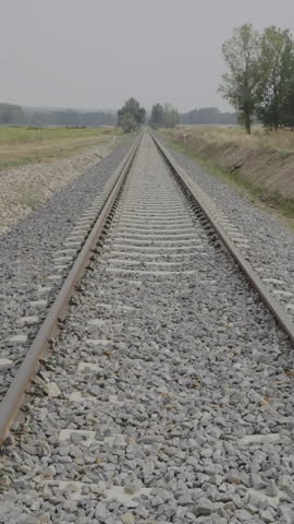 Empty railway tracks converge towards the horizon near Quintana Redonda, Spain, creating a sense of distance and perspective