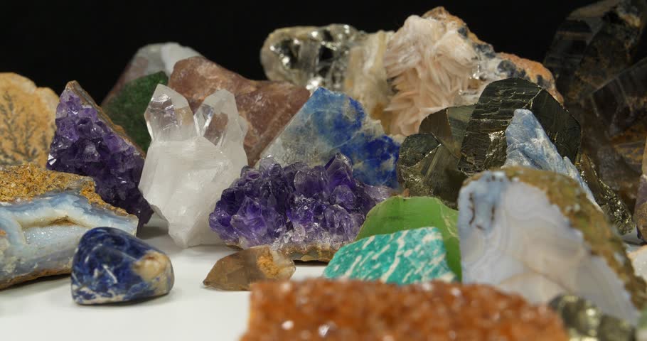 Semi Precious stones and minerals. Purple Amethysts, Quartz crystals, blue Lazurite, Agate, Green garnet or Uvarovite, green Nephrite and Amazon stone, Citrine, Barite, blue Kyanite and golden Pyrite