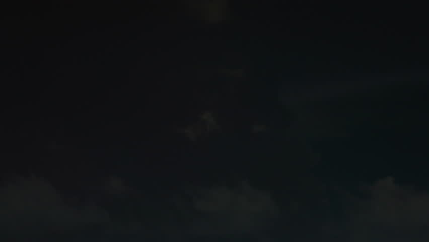 Time lapse captures flashes of lightning strikes within a dark thunderstorm cloud, revealing the storm’s intense electrical activity and dramatic movement across the sky