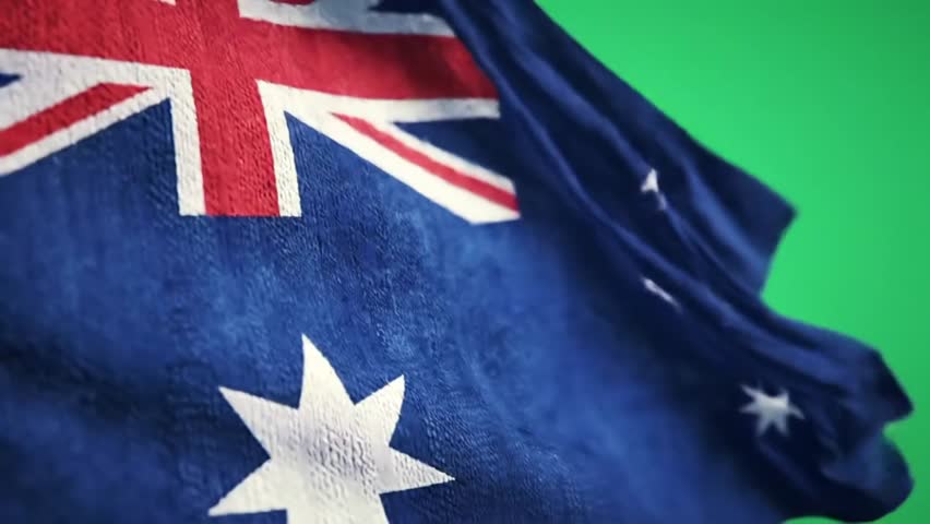 Ultra-realistic slow-motion Australian flag flowing gracefully in the wind. Isolated on a clear green background with sharp details and smooth motion, perfect for compositing and patriotic themes.