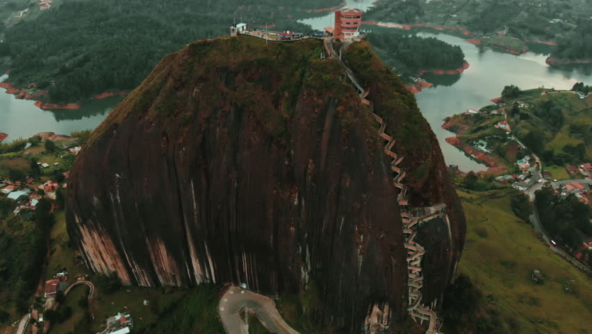 Explore breathtaking mountain viewpoint overlooking serene lake and landscape