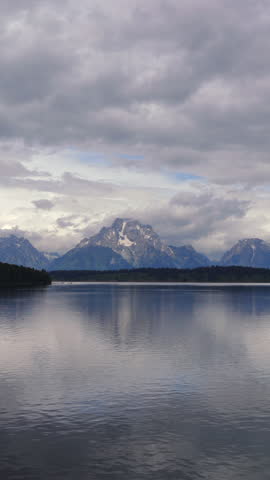 Embark on an unforgettable journey that allows you to explore the breathtaking Grand Teton National Park, where majestic mountains tower above tranquil lakes that beautifully reflect the stunning sky