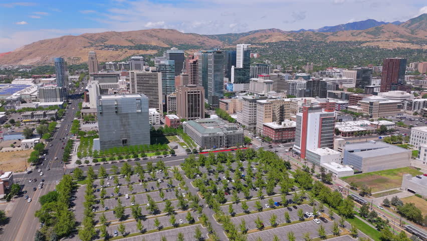 Aerial views of Salt Lake City in Utah showcase its vibrant skyline with modern architecture and beautiful natural landscapes, creating picturesque spot for visitors and residents to explore and enjoy