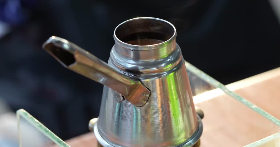 A coffee pot for brewing coffee, a traditional coffee pot such as those used in Ethiopian coffee ceremonies	