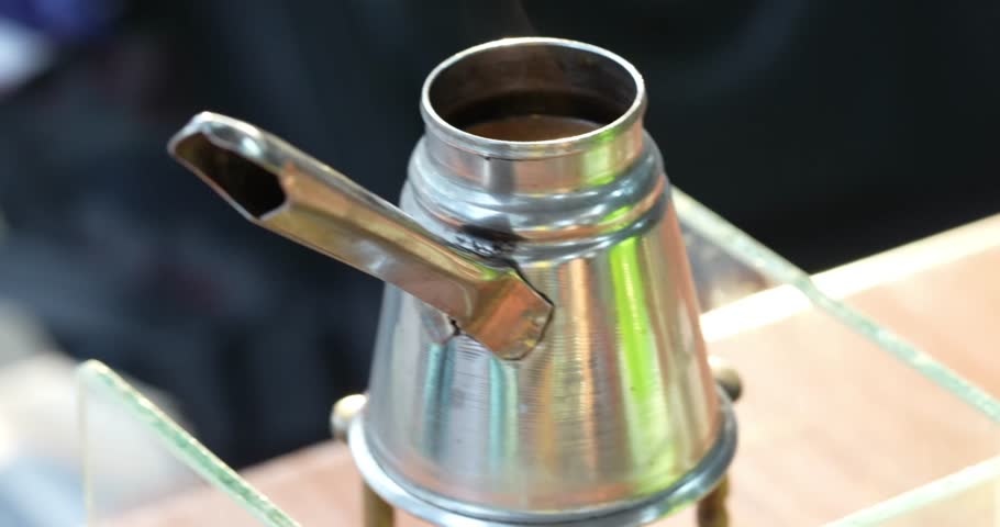 A coffee pot for brewing coffee, a traditional coffee pot such as those used in Ethiopian coffee ceremonies	