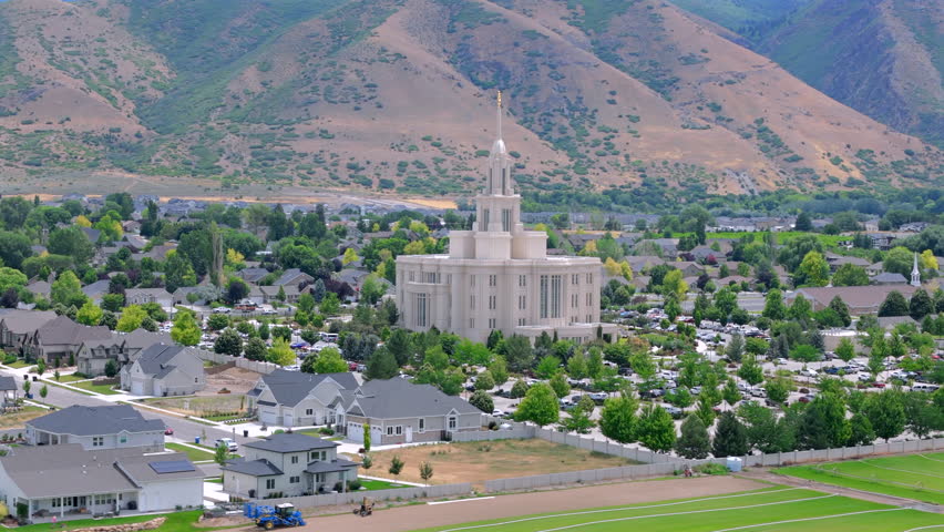 Explore the stunning aerial views of the iconic Payson Utah Mormon Temple, a significant landmark for The Church of Jesus Christ of Latterday Saints, amidst beautiful rural landscapes