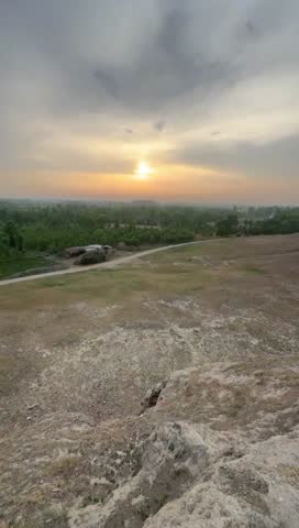A View from the Shaikhan Dheri Mound
Description: Witness a stunning sunset over the plains of Charsadda, Pakistan, from the historic Shaikhan Dheri mound.