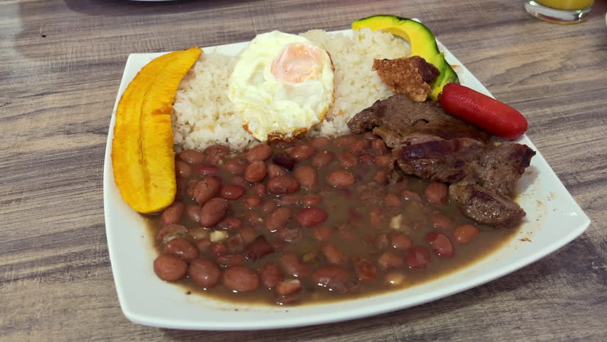Classic Medellin plate with beans rice meat egg and plantain