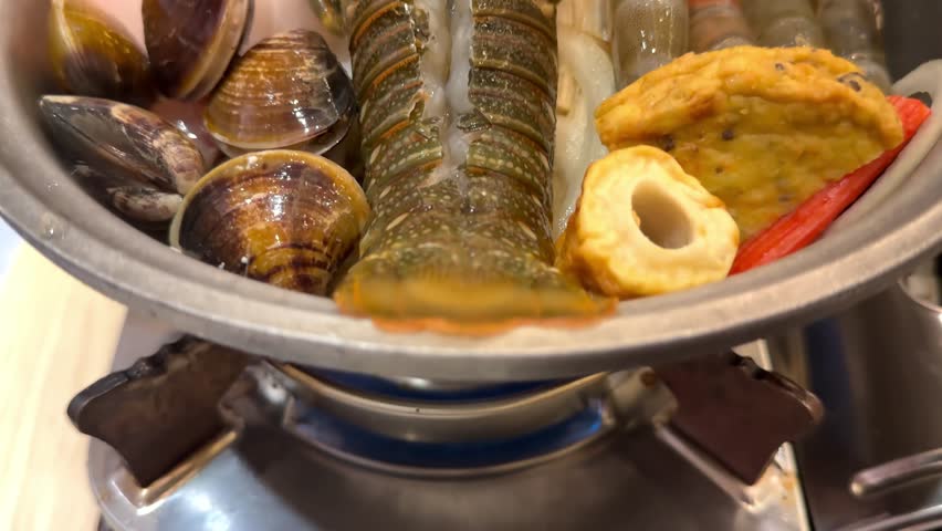 Lobster Nabe, Lobster served hot with vegetables in a pot, Lobster served in hot pot meal with vegetables and meat