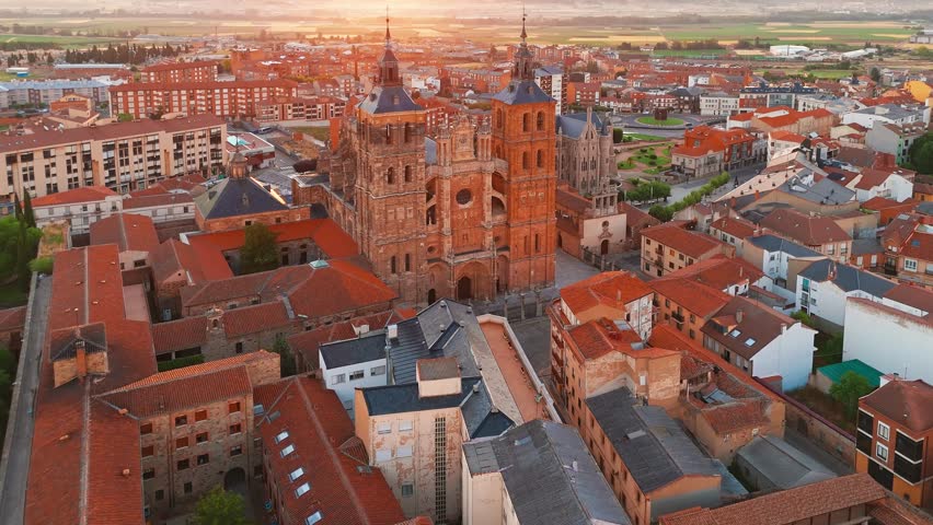Aerial view of Astorga town in Castilla y Leon, northern Spain. Historic medieval Old Town and important stop along the Camino de Santiago pilgrimage route. Cathedral and Episcopal Palace at sunrise