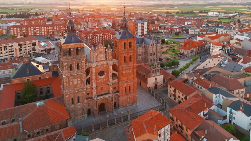 Aerial view of Astorga town in Castilla y Leon, northern Spain. Historic medieval Old Town and important stop along the Camino de Santiago pilgrimage route. Cathedral and Episcopal Palace at sunrise