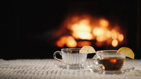 pour tea into cup on background of fireplace tea in cozy setting. flame fire blurred. citrus coffee in cup close up. Fresh hot herbal tea with mint and oranges, healthy morning, detox drink. Turkish - Powered by Shutterstock - Get 15% off with code: PIKWIZARD15
