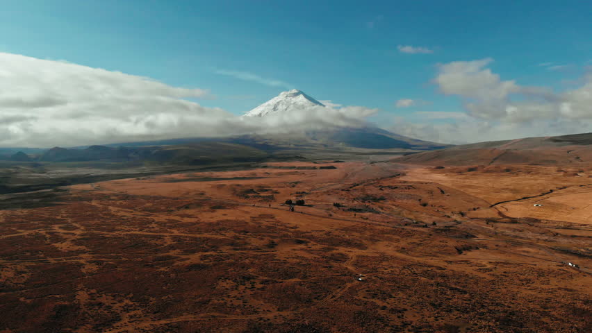 Explore the beauty of dry countryside near majestic snow-capped mountain