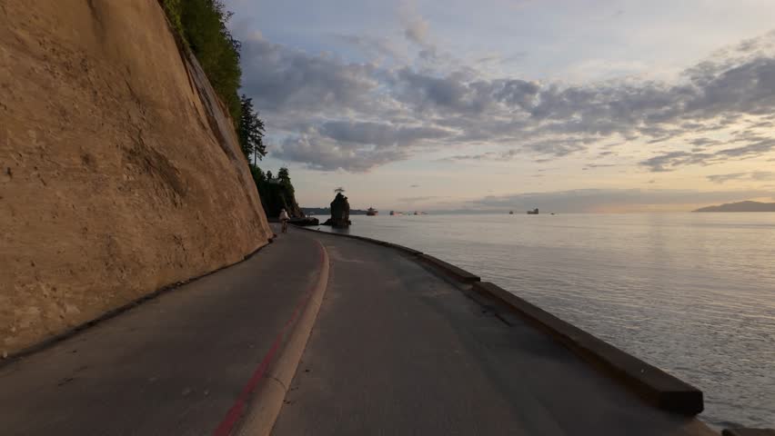 Scenic Sunset View of Vancouver Seawall in Stanley Park Along the Pacific Ocean