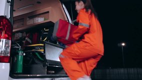 Emergency medical technician (EMT) team or paramedic nurse walking and jumping to ambulance car - Powered by Shutterstock - Get 15% off with code: PIKWIZARD15