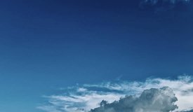 Cinematic timelapse of billowing cumulus clouds drifting under a vivid blue sky. Smooth motion ideal for backgrounds, documentaries, and travel edits. - Powered by Shutterstock - Get 15% off with code: PIKWIZARD15