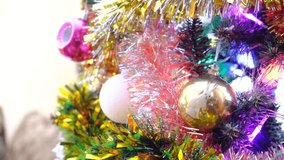 Close up a Christmas tree lights glittering at night. Festively decorations. Christmas tree branches with bright balls on blurred sparkling fairy background. Night scene. Atmospheric fairy mood - Powered by Shutterstock - Get 15% off with code: PIKWIZARD15