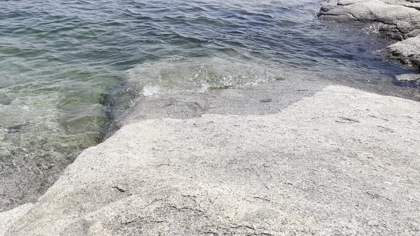 Lake Wave Rolling onto Large Stone