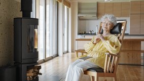 Senior woman reading indoors in a house - Powered by Shutterstock - Get 15% off with code: PIKWIZARD15