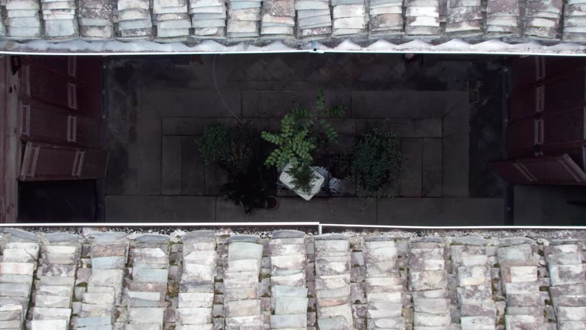 Drone view villages and farmlands among green mountains, high angel view rural buildings in autumn day, 4k real time footage b roll shot, Nanping village, Yixian, Anhui, China.