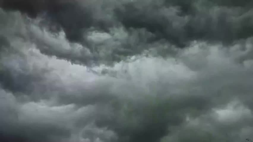 Dramatic stormy sky with dark swirling clouds over Europe. Perfect moody weather background for films, travel projects, presentations, and creative designs needing an intense atmosphere.