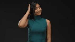 Woman standing outdoors latina with hand on head in casual attire expressing thoughtful expression on city street during daylight. - Powered by Shutterstock - Get 15% off with code: PIKWIZARD15