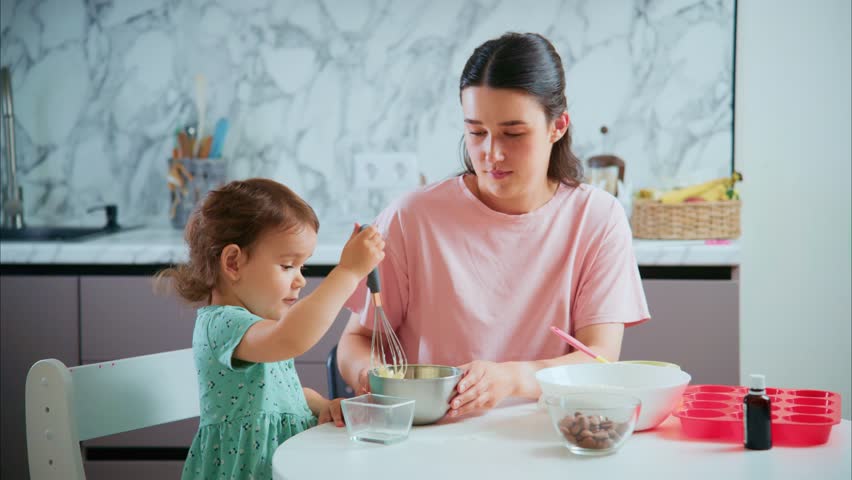 A Heartwarming Moment of Connection: A Parent and Child Bonding Over Baking in a Cozy Kitchen, Creating Sweet Memories Together