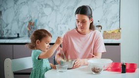 A Heartwarming Moment of Connection: A Parent and Child Bonding Over Baking in a Cozy Kitchen, Creating Sweet Memories Together - Powered by Shutterstock - Get 15% off with code: PIKWIZARD15