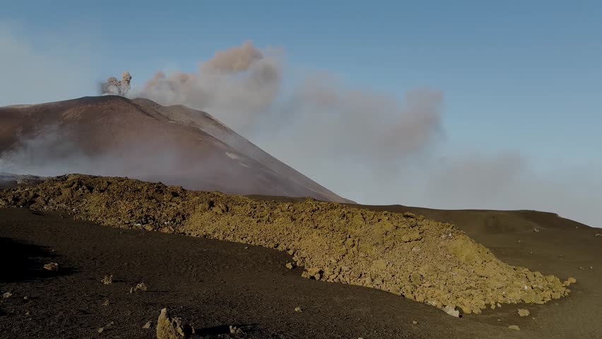 Etna on August 20, 2025. Effusive activity with lava flows, caves, spattering, hornito, and explosions from the southeast crater. Sunset with incandescent lava in Sicily.