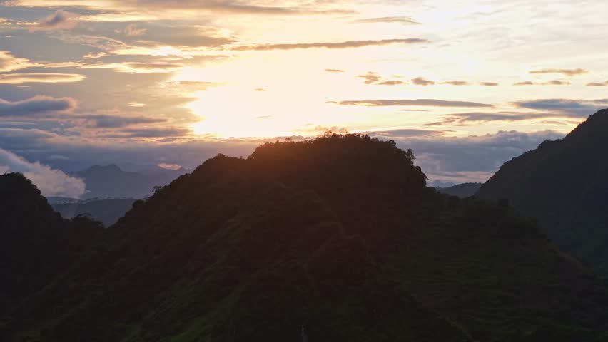 Sunset over a cloudy mountain landscape