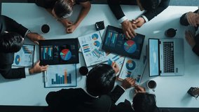 Top down aerial view of smart project manager present growth graph while marketing team analyze chart at meeting table with.laptop, tablet and stock market financial statistic document. Directorate. - Powered by Shutterstock - Get 15% off with code: PIKWIZARD15