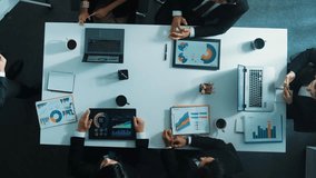 Top down aerial view of manager standing and present business plan to skilled investor. Business team working together to analyze financial statistic graph at meeting table. Time lapse. Directorate. - Powered by Shutterstock - Get 15% off with code: PIKWIZARD15
