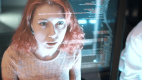 Female programmer is writing code to create a software anti-hacker system to protect financial system database data. A coder or developer working late in a computer display in problem solving. - Powered by Shutterstock - Get 15% off with code: PIKWIZARD15