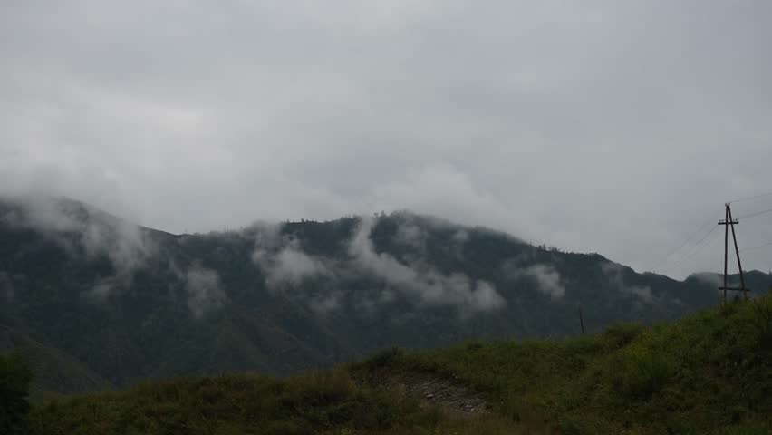 Dark Clouds Over Pine Forest Mountains