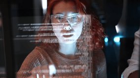 Female programmer is writing code to create a software anti-hacker system to protect financial system database data. A coder or developer working late in a computer display in problem solving. - Powered by Shutterstock - Get 15% off with code: PIKWIZARD15