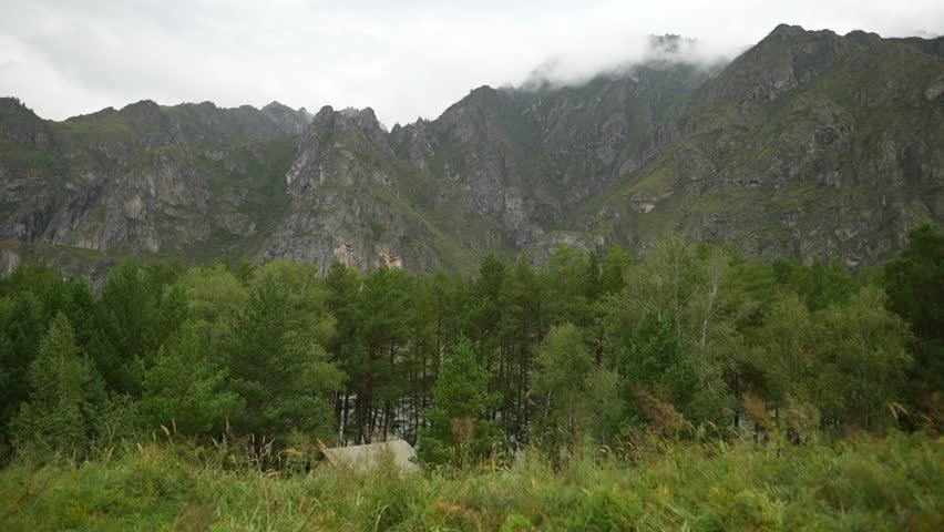 Dark Clouds Over Pine Forest Mountains